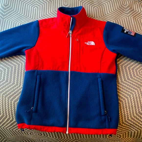 red and blue north face jacket